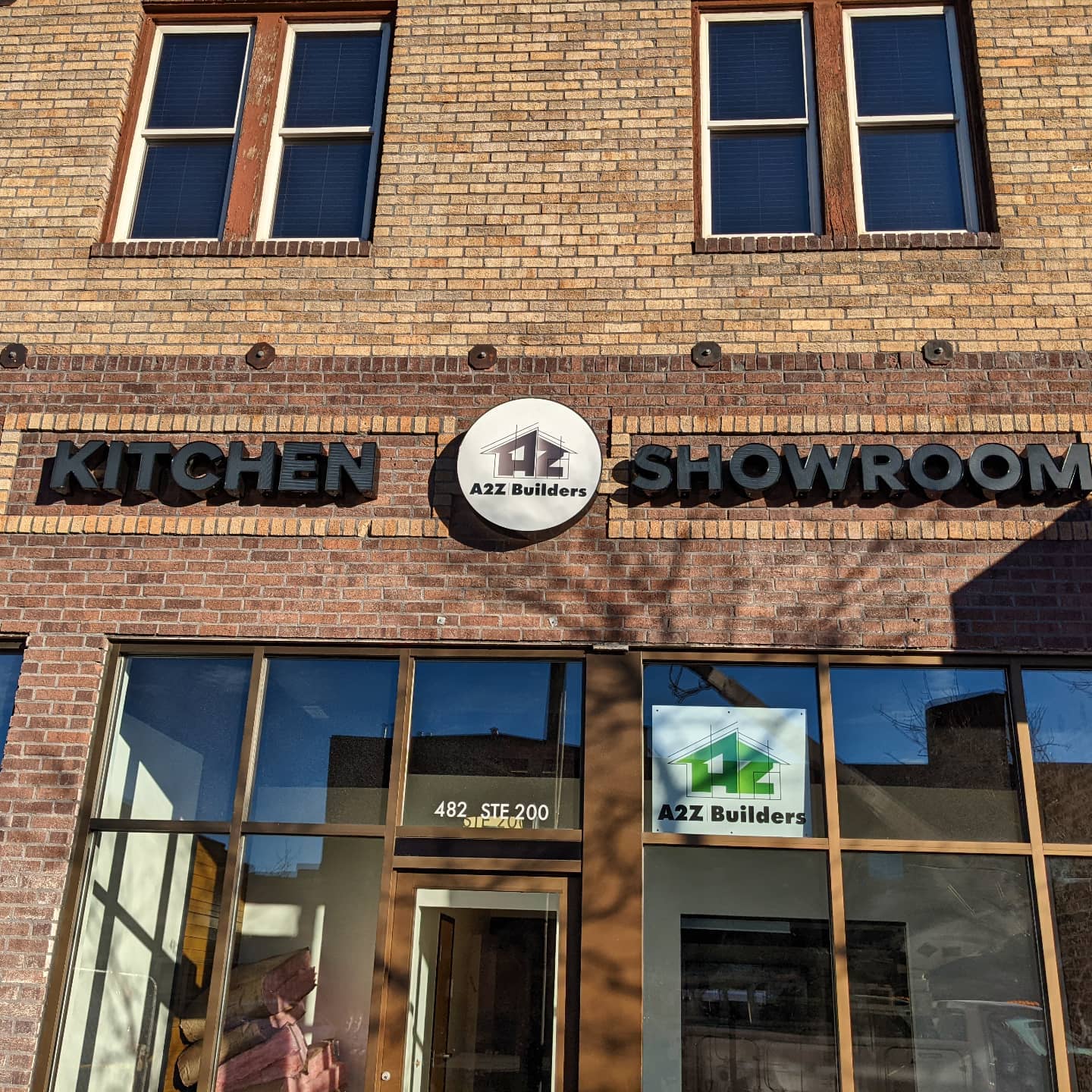 Channel letter sign we made for @reflectionsigns. White acrylic with black perforated vinyl on the faces light up white at night. The logo box is front and rear lit. @a2z.builders.colorado